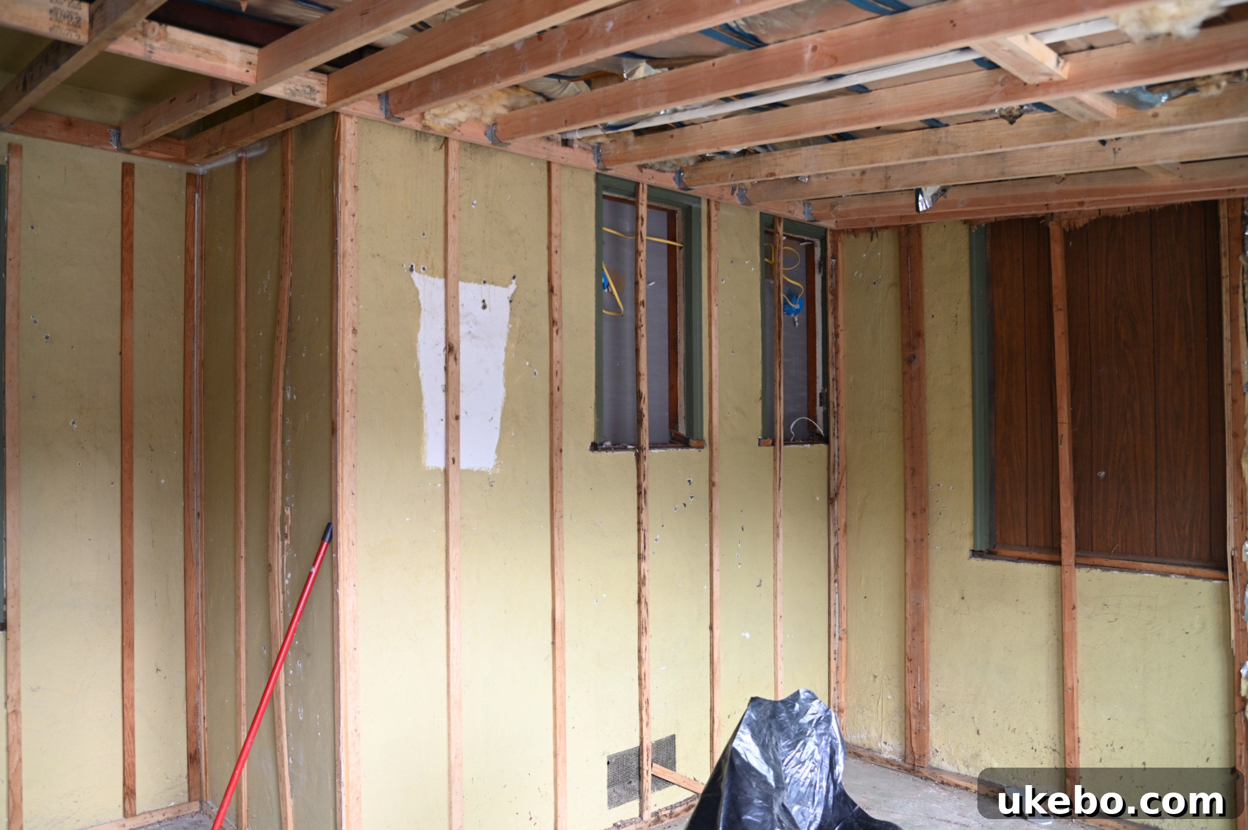 Walls stripped down, revealing original structure.