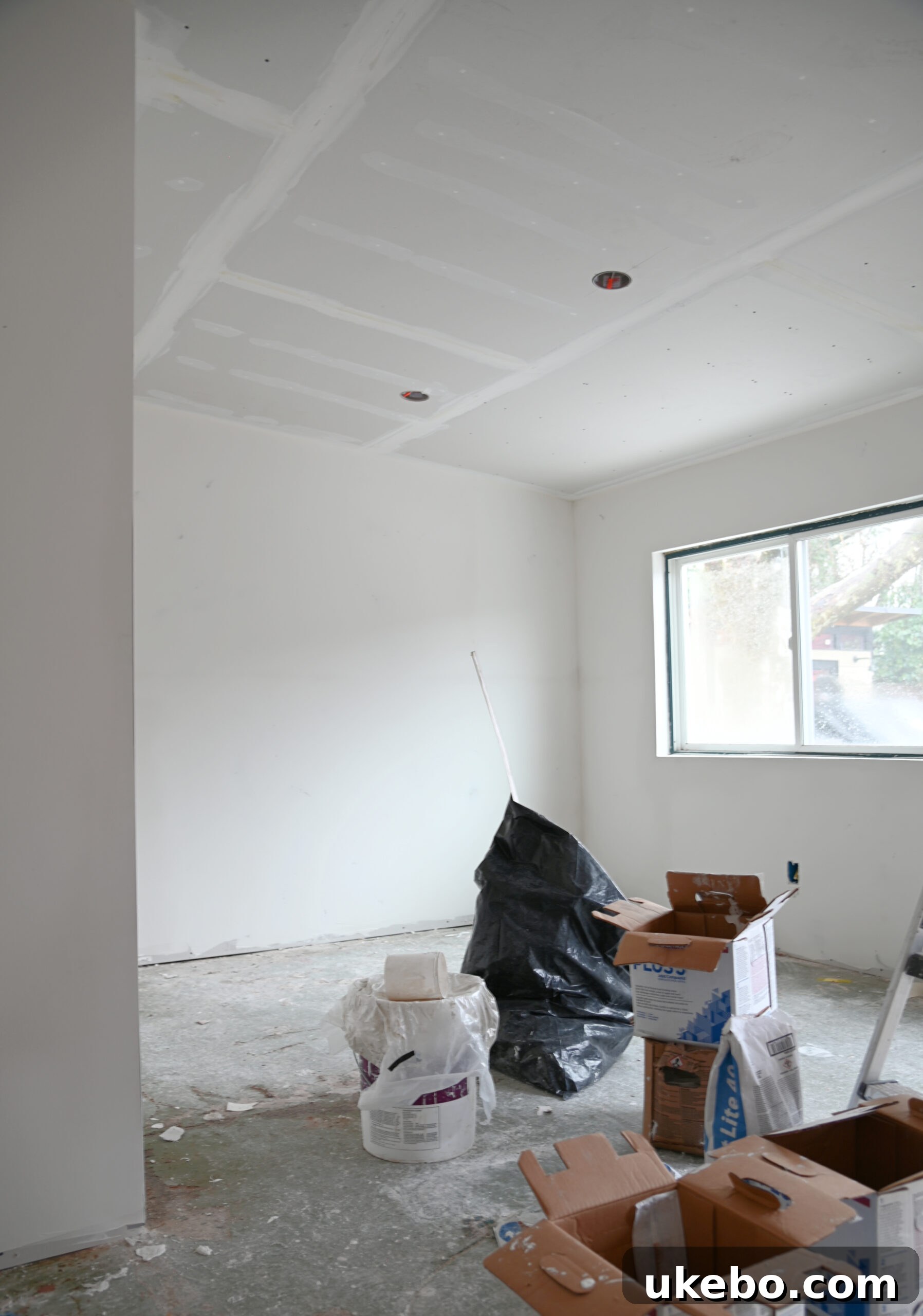 Walls prepped for drywall, showing new electrical boxes.