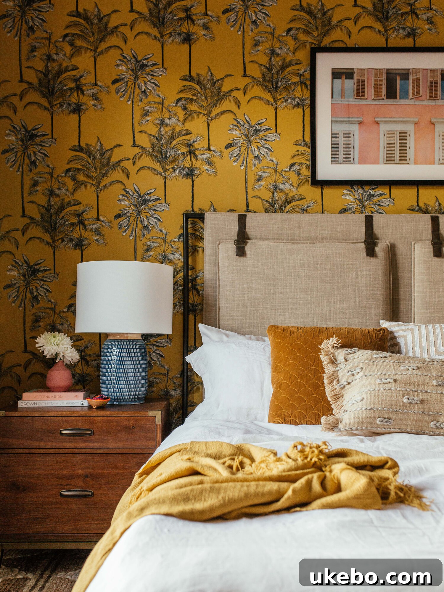 Bedroom with unique art and a mix of vintage and modern pieces.