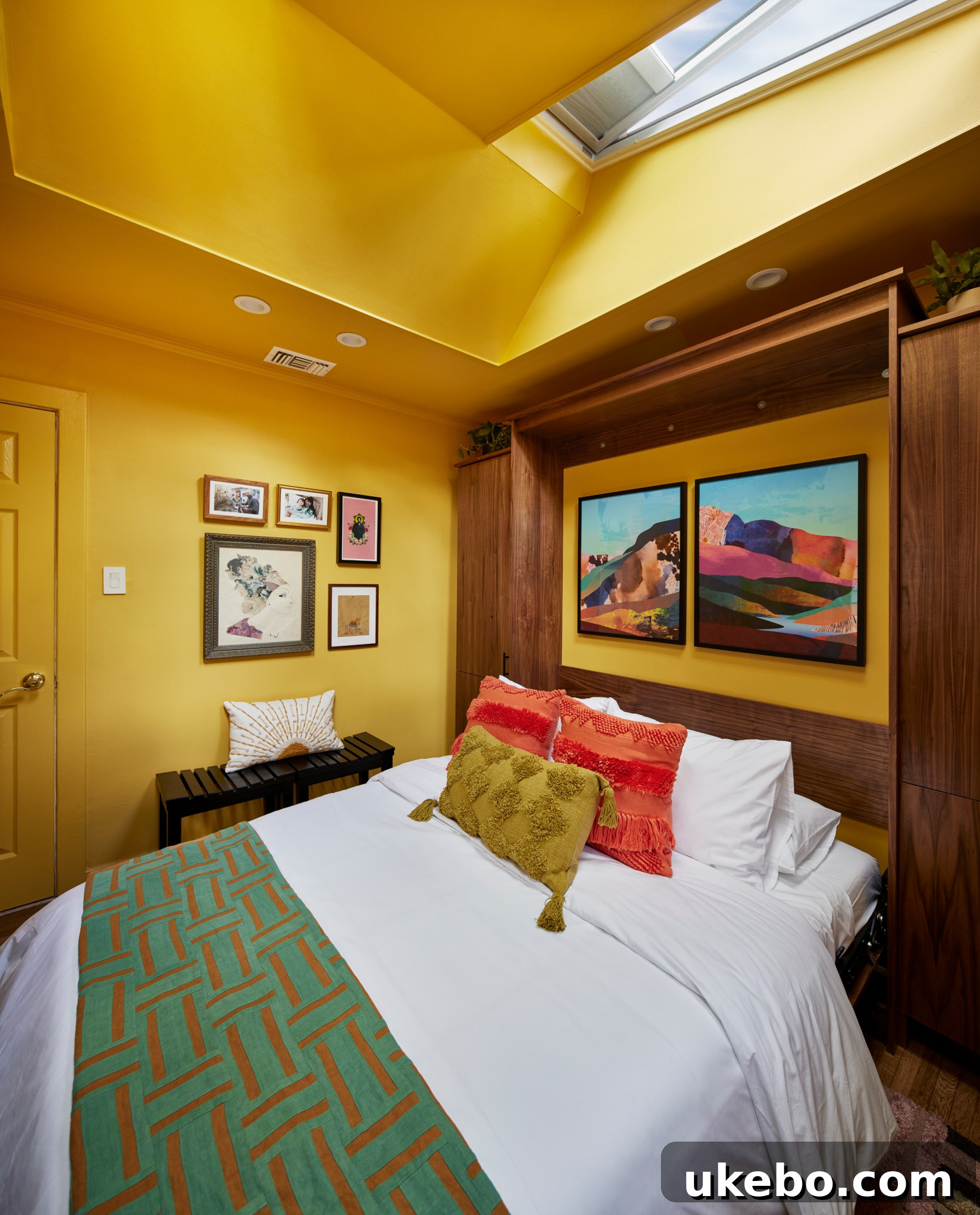Detail shot of vibrant art and decor against the golden yellow wall, with plenty of natural light