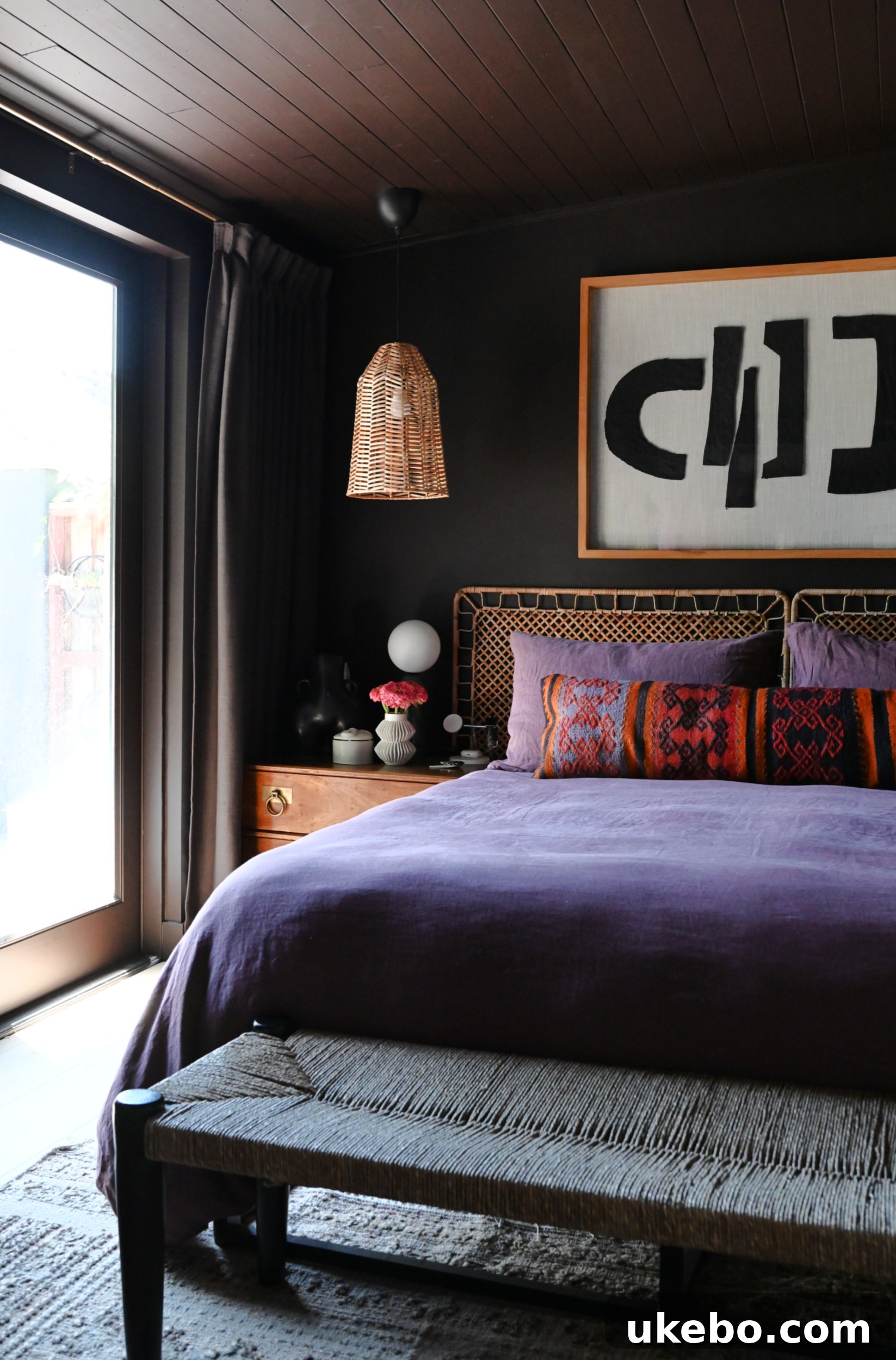 Weathering the Storm: Crafting a Dreamy Cave Sanctuary 2 A glimpse into the newly renovated primary bedroom, featuring a deep chocolate brown color palette and elegant furnishings.