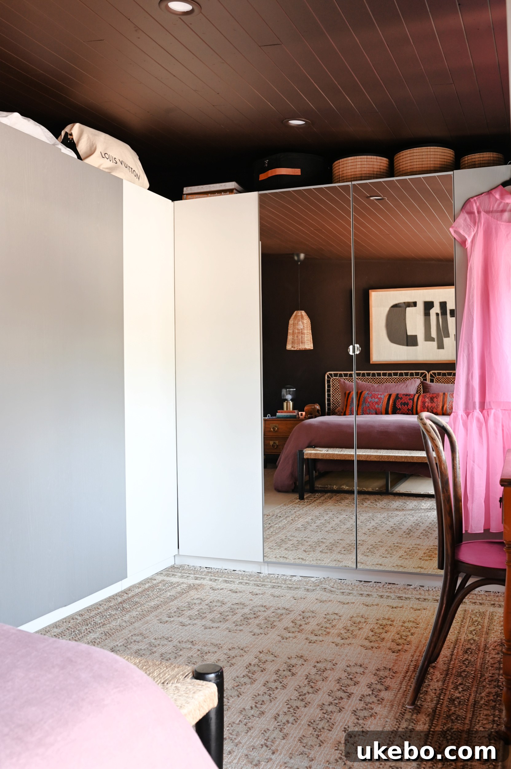 A view of the reconfigured primary bedroom, now featuring a dedicated dressing area and vanity.
