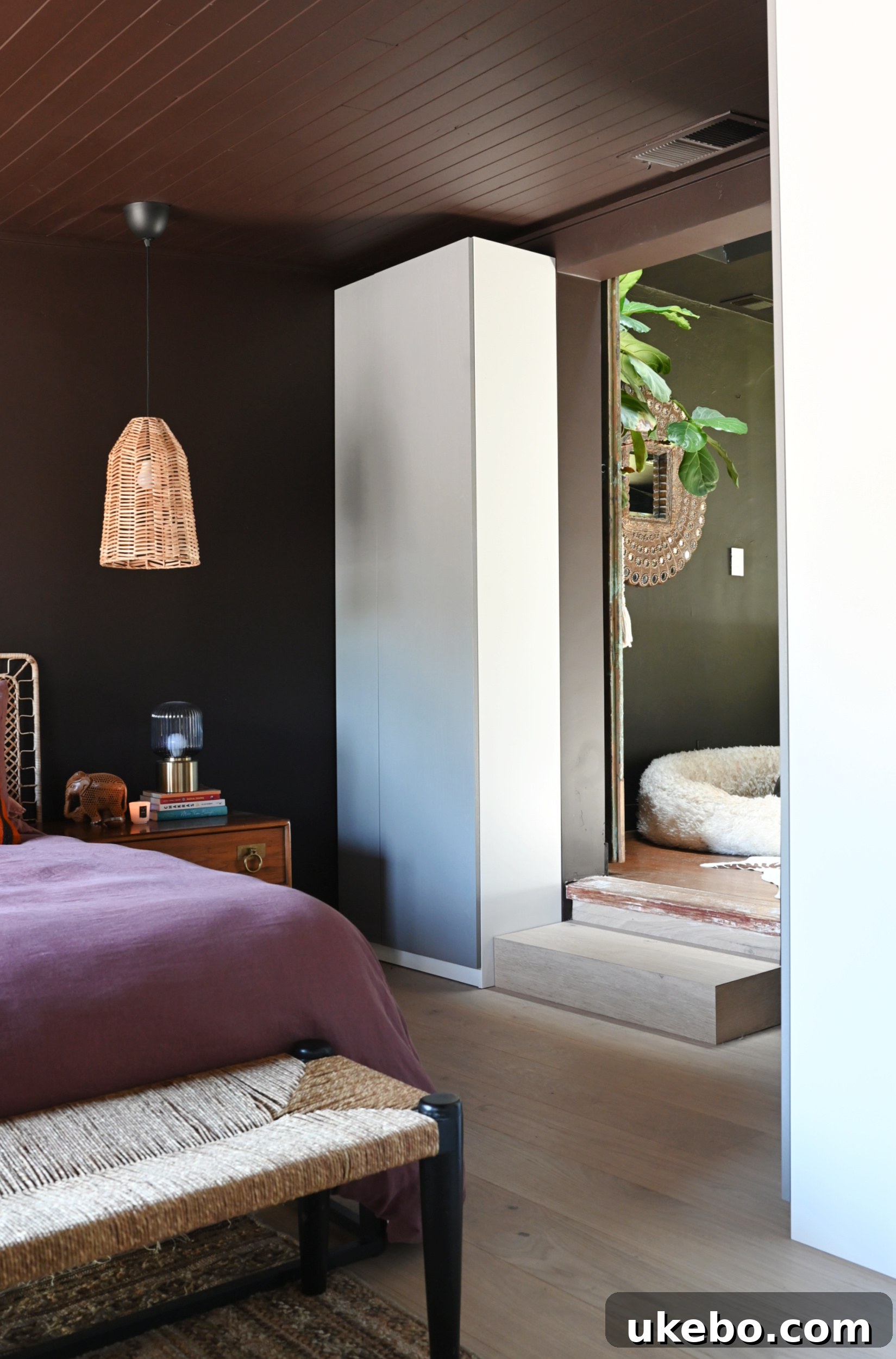 Weathering the Storm: Crafting a Dreamy Cave Sanctuary 13 Integrated IKEA PAX wardrobes, extended to provide ample storage for shoes and clothing, blending with the bedroom design.