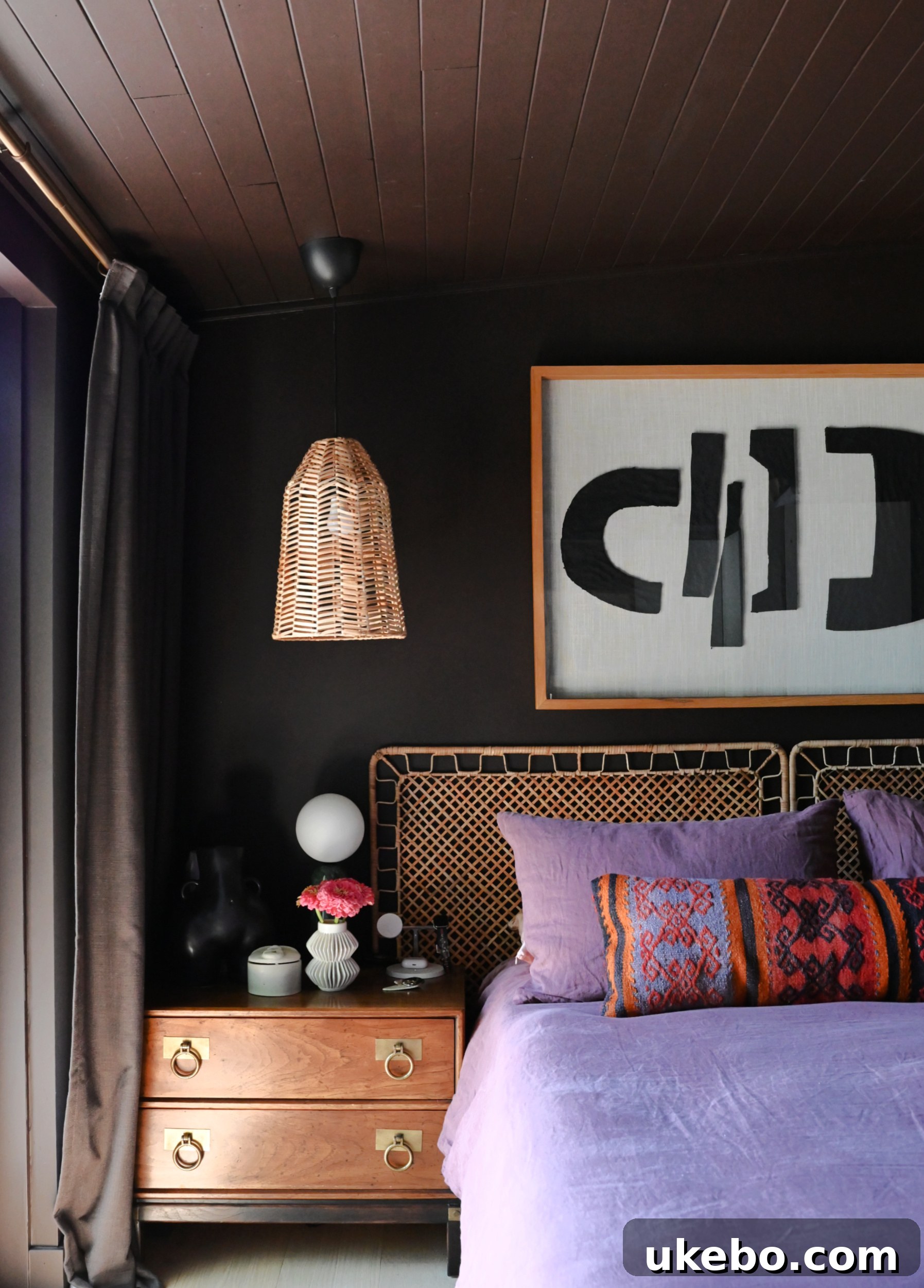 Weathering the Storm: Crafting a Dreamy Cave Sanctuary 5 The primary bedroom bathed in Sherwin-Williams Black Bean SW6006, showcasing the monochromatic paint scheme on walls, ceiling, and trim.