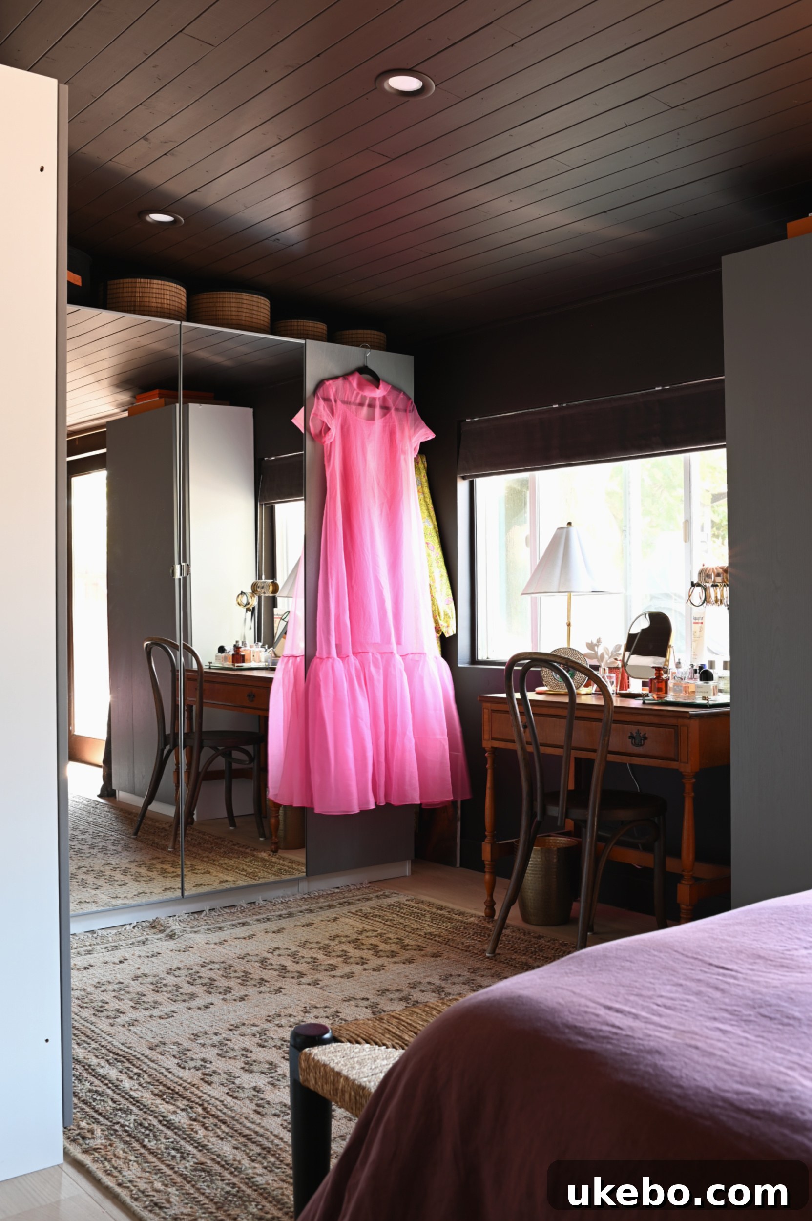 The primary bedroom showing the new layout with the bed positioned against a wall of wardrobes, enhancing the 