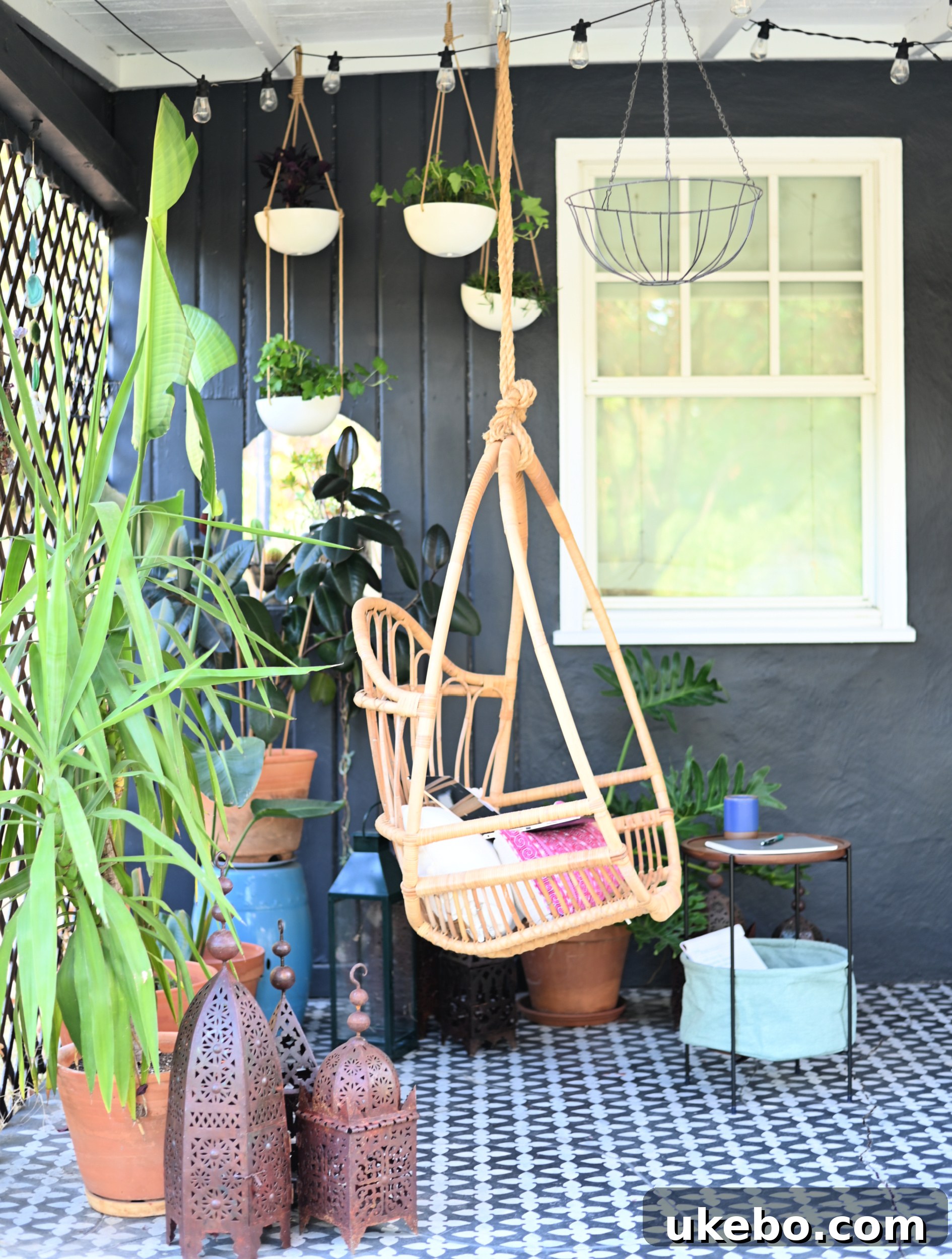Cozy side porch with comfortable seating and greenery